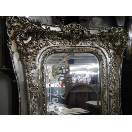 649 - A large mirror in silvered frame, 180 x 90 cm.