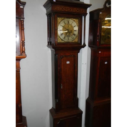 653 - A good brass square dial long case clock on three bells by Matthew Bufnell,