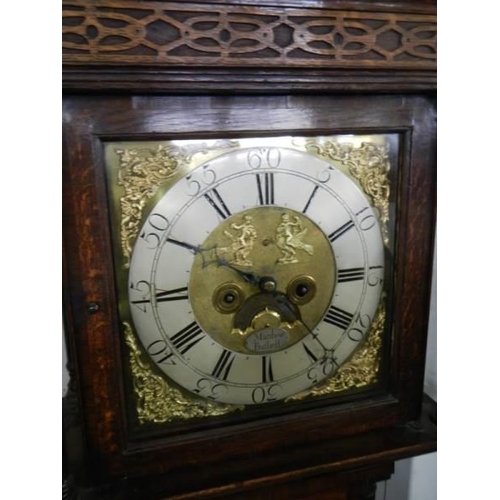 653 - A good brass square dial long case clock on three bells by Matthew Bufnell,