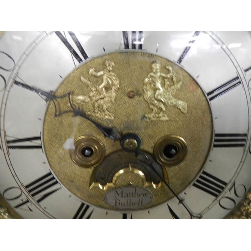 653 - A good brass square dial long case clock on three bells by Matthew Bufnell,