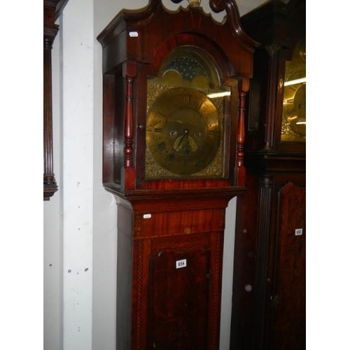 654 - A good eight day long case clock with brass arched dial