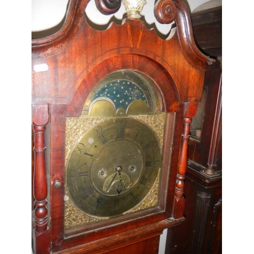 654 - A good eight day long case clock with brass arched dial