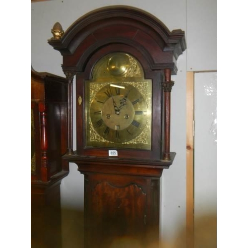 655 - A good eight day long case clock with brass arched dial