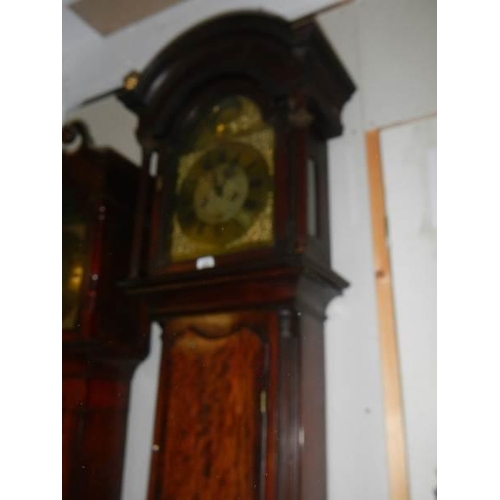 655 - A good eight day long case clock with brass arched dial