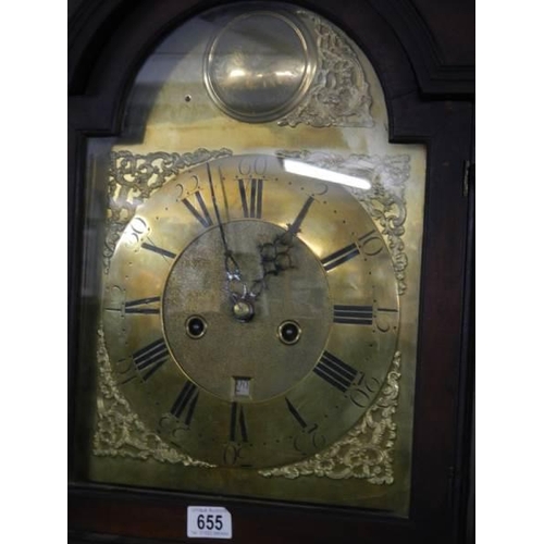 655 - A good eight day long case clock with brass arched dial