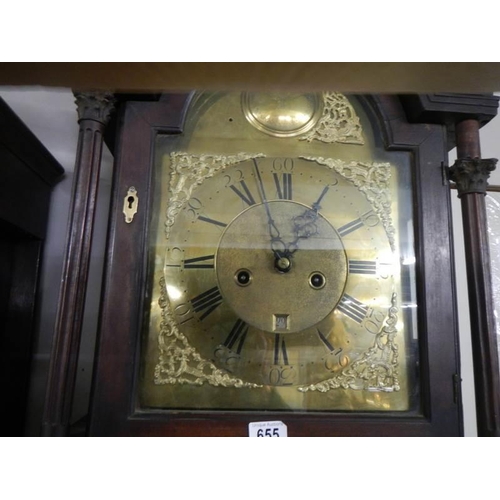 655 - A good eight day long case clock with brass arched dial