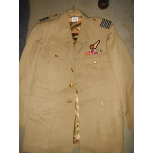 658 - Two military jackets.