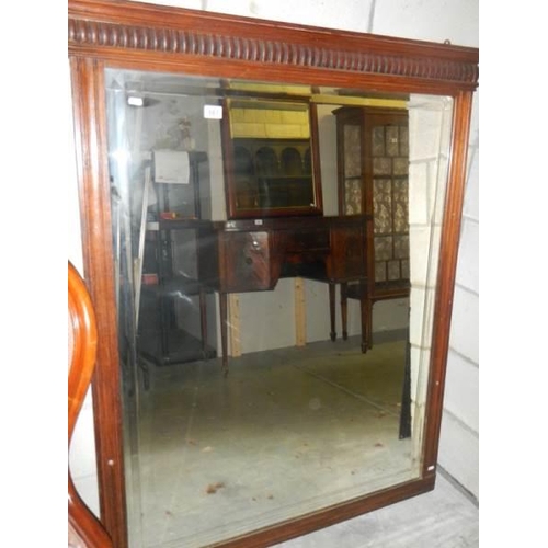 661 - A large mahogany framed bevel edged mirror.