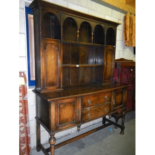 664 - An early 20th century oak dresser.