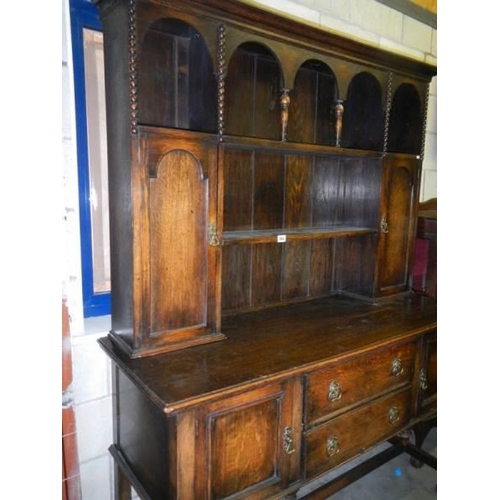 664 - An early 20th century oak dresser.