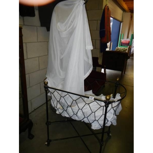 667 - A late Victorian babies crib with drapes.