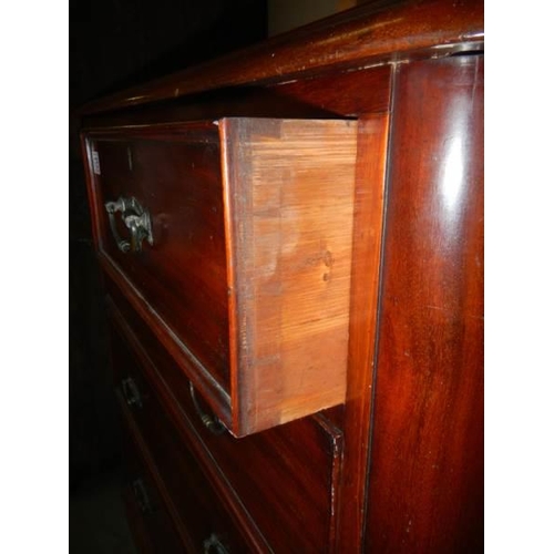 675 - A Victorian mahogany two over three chest of drawers.