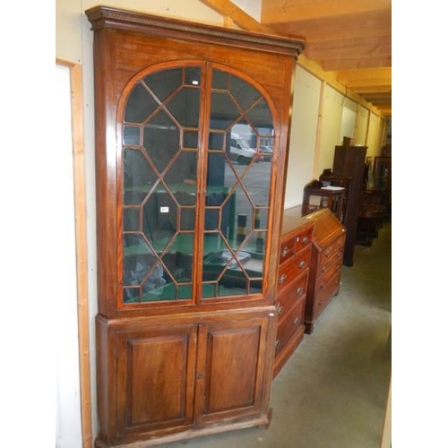 677 - A large Victorian glazed top door corner cupboard.