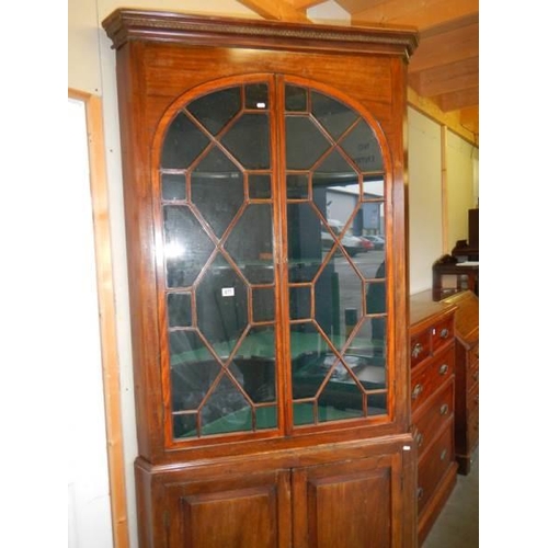 677 - A large Victorian glazed top door corner cupboard.