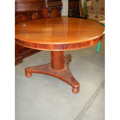 678 - A Victorian mahogany circular tip top table.