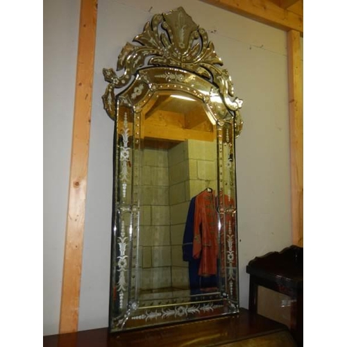 680 - A large engraved gypsy style mirror.