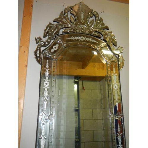 680 - A large engraved gypsy style mirror.