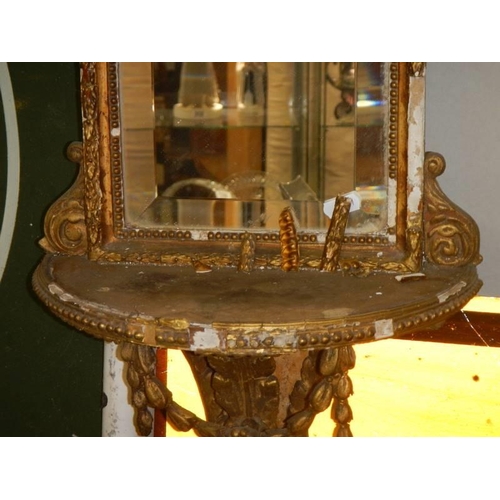 590 - An early 19th century gilt framed mirror in need of restoration.