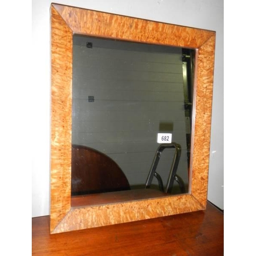 682 - A bird's eye maple framed mirror.