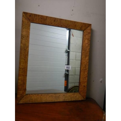 682 - A bird's eye maple framed mirror.