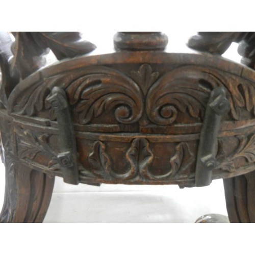 462 - An early heavily carved Burmese chair. COLLECT ONLY.