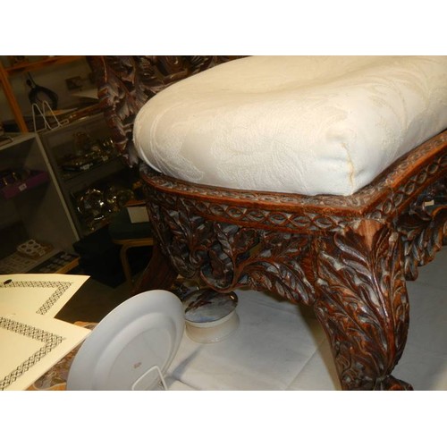 462 - An early heavily carved Burmese chair. COLLECT ONLY.