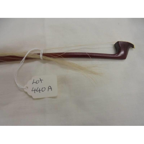 440A - A fibre glass violin bow by P & H London, 63cm long, needs re-stringing.