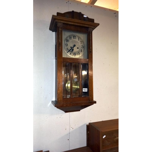 1633 - A 1930's oak wall clock. COLLECT ONLY.