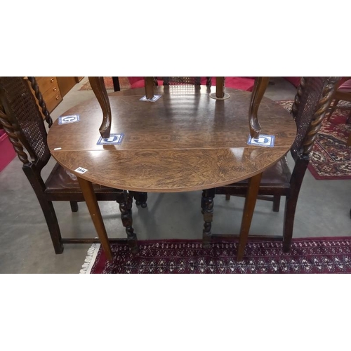 1644 - A 1970's round drop leaf Formica kitchen table COLLECT ONLY.