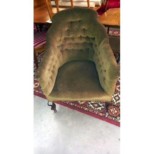 1649 - An Edwardian deep buttoned tub chair, missing a castor COLLECT ONLY.