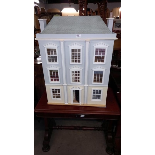 1687 - A Georgian style 3 storey Doll's house - 66cm x 34cm x 85cm COLLECT ONLY.