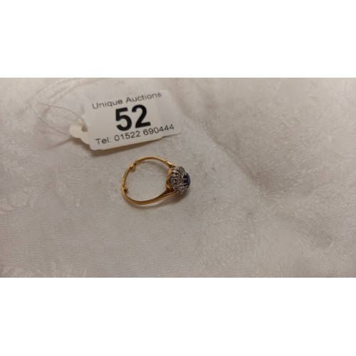 52 - A diamond and sapphire cluster ring, dated and hall marked Birmingham 1967, size N half, 3.4  grams.