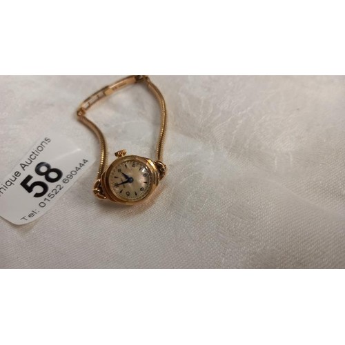 58 - A 9ct gold vintage ladies wrist watch, total weight 14.8 grams.