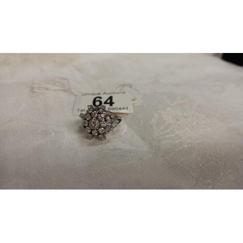 64 - A diamond cluster ring, approximately 1.75 carats total in a starburst design, 14ct white gold set, ... 