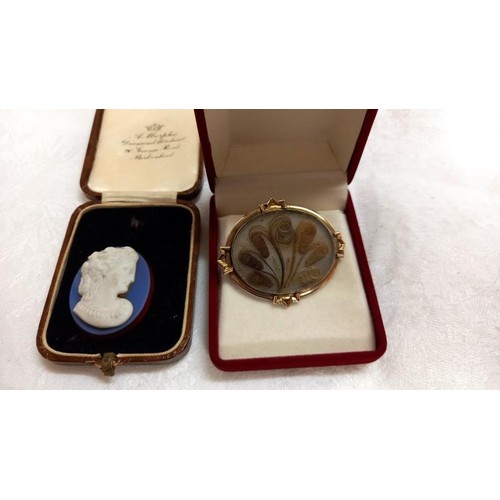 89 - A gold 19th century sentimental brooch set with hair in a fan design with locket back, as silver bro... 