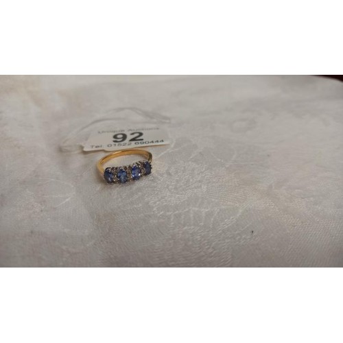 92 - Four oval tanzanites interspaced with three rows of diamonds in 18ct gold ring, size P half, 3.7 gra... 