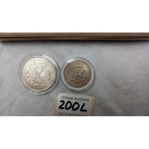 200L - A boxed collectors coin and knife series set 'Walking Liberty Dollar' and other American coins.