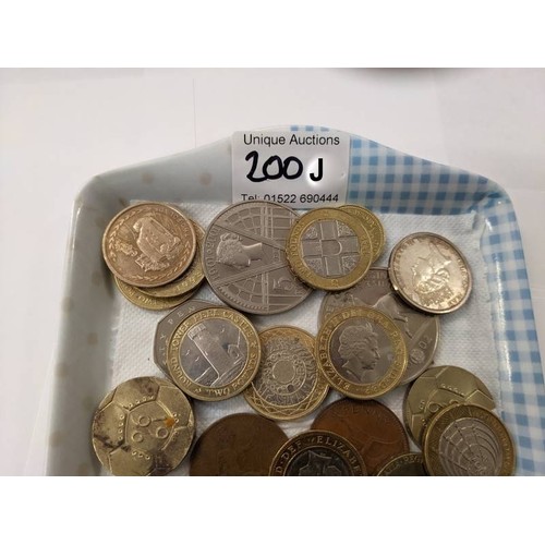 200J - A mixed lot of unusual coins including 50p & £2 including a copy of the Kew Gardens 50p, no date 20p... 