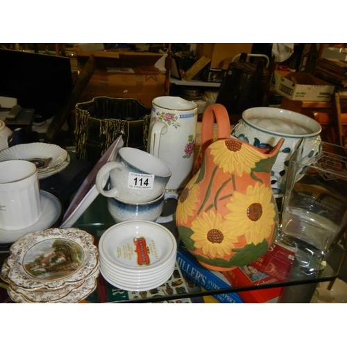 114 - A mixed lot including jugs, vases, jardiniere, mugs etc.,