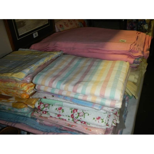 46 - A quantity of flannelette sheets and pillow cases plus some cotton sheets.