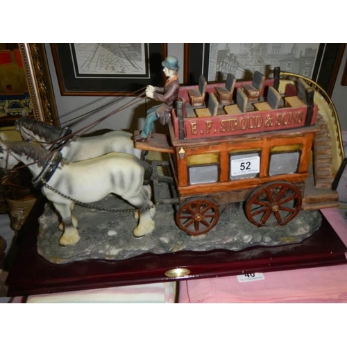 52 - A 20th century ceramic horse drawn bus pulled by two horses, COLLECT ONLY.