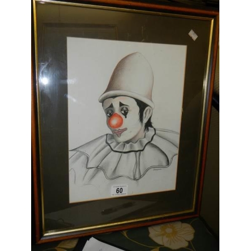 60 - A framed and glazed study of a clown signed P McKenna plus one other.