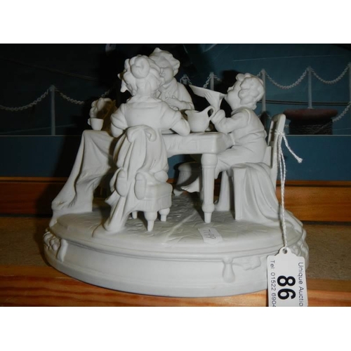 86 - A mid 20th century parian figure depicting a children's tea party.