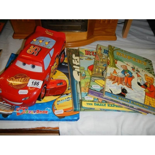 186 - A quantity of children's books and a toy car.