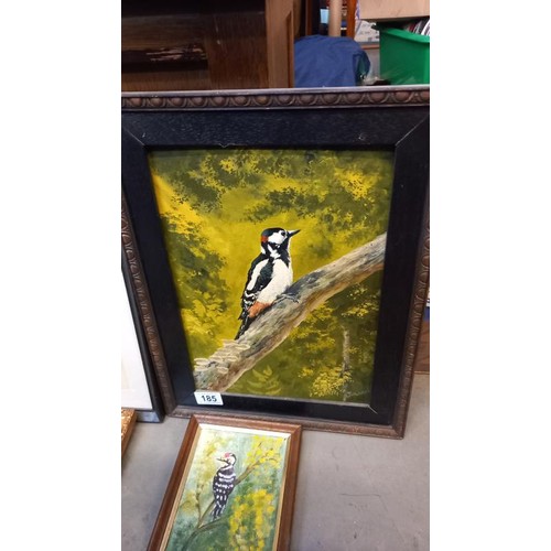 185 - A framed painting of a woodpecker and another bird picture.