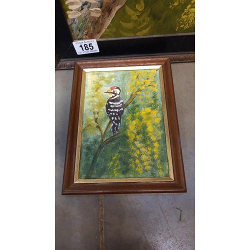 185 - A framed painting of a woodpecker and another bird picture.