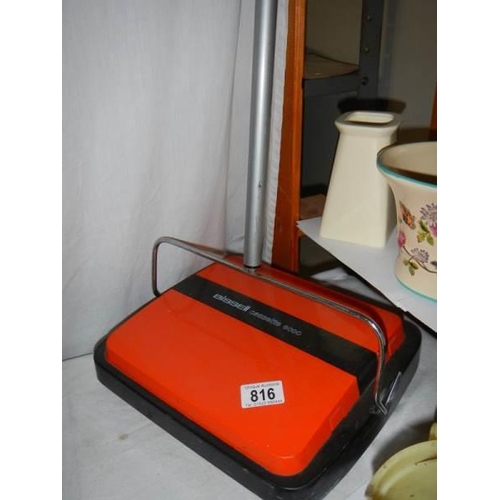 816 - A Bissell carpet sweeper.