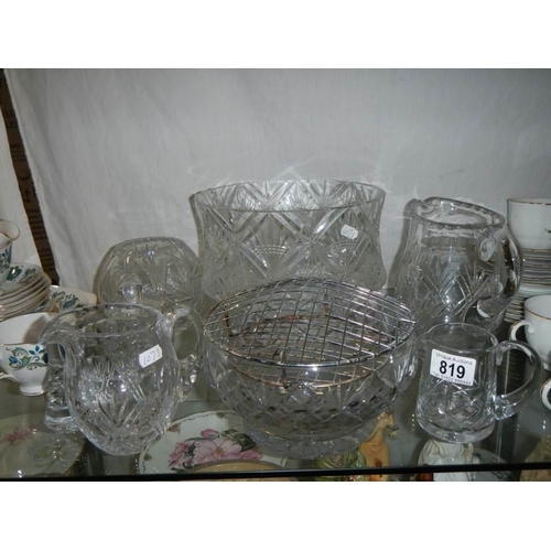 819 - A shelf of glass ware.