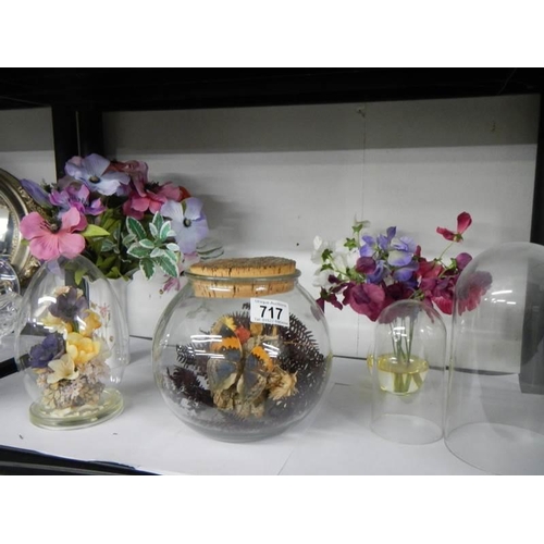 717 - Two floral diorama's under glass, two plastic clock domes and artificial flowers.