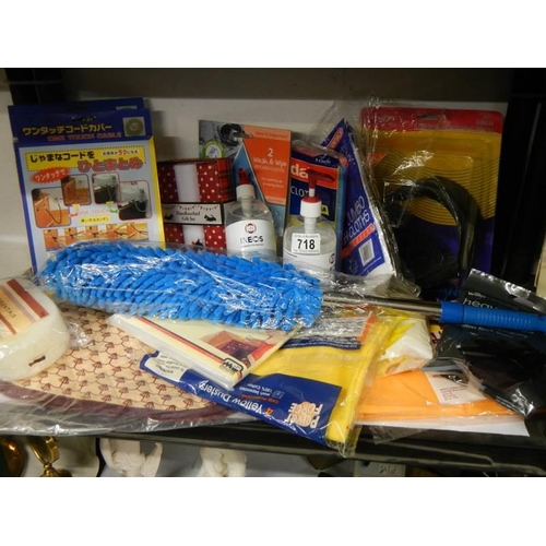 718 - A shelf of miscellaneous including dusters, gloves, sterile sanitizer etc.,